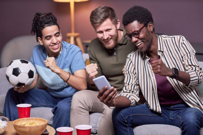 diverse-group-of-friends-watching-sports-match-onl-2023-03-18-02-43-17-utc_Easy-Resize.com